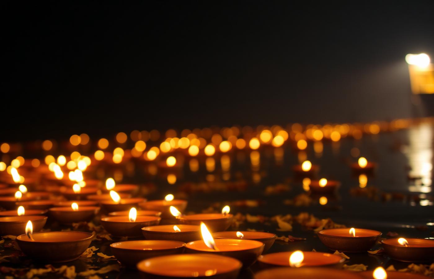 Diyas glowing on the sacred river